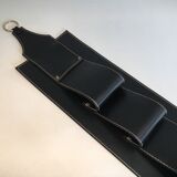 Leather wall-mounted magazine rack. Attributed to Jacques Adnet