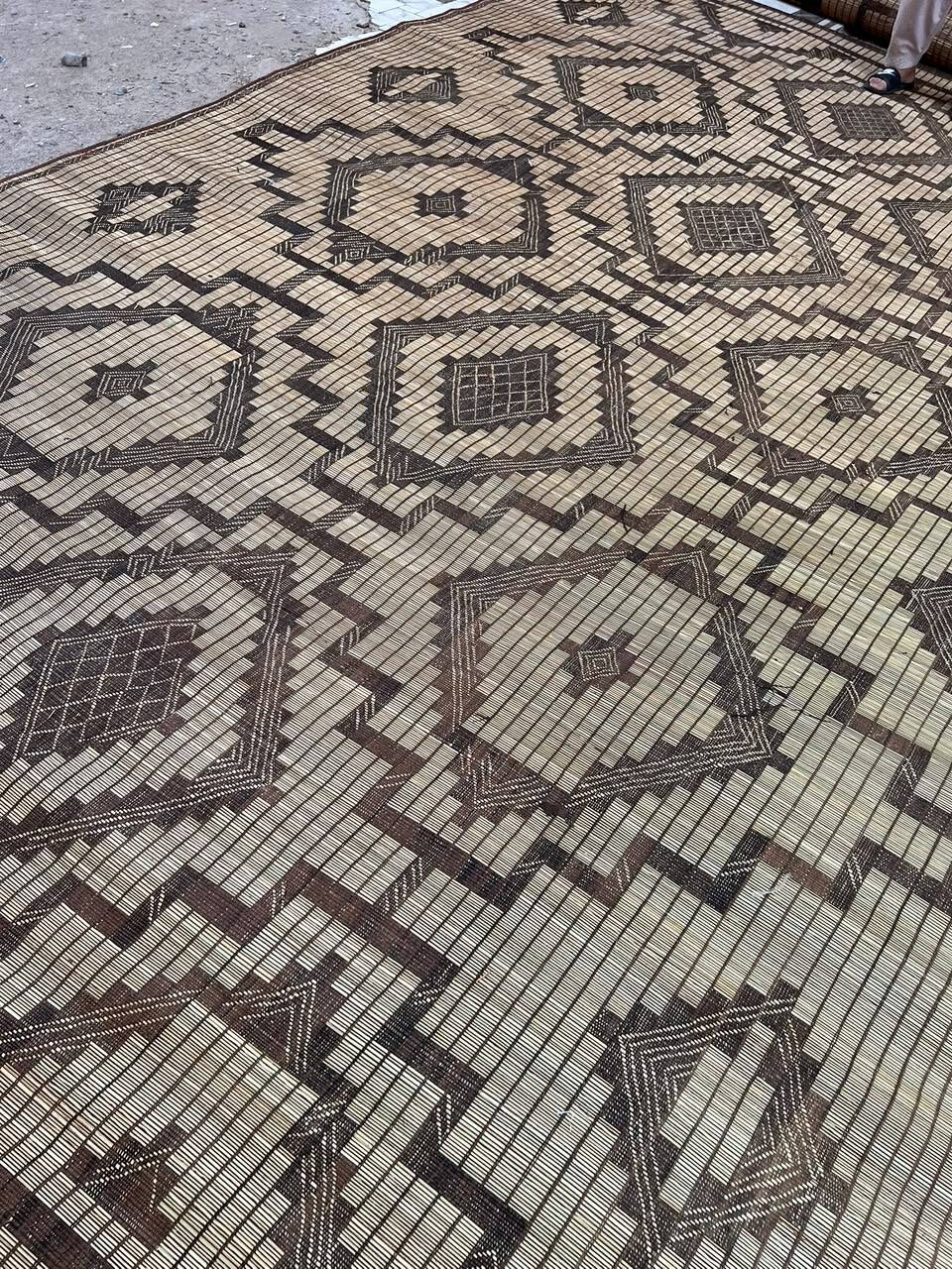 Vintage Touareg mat made of leather and reeds.