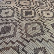 Vintage Touareg mat made of leather and reeds.