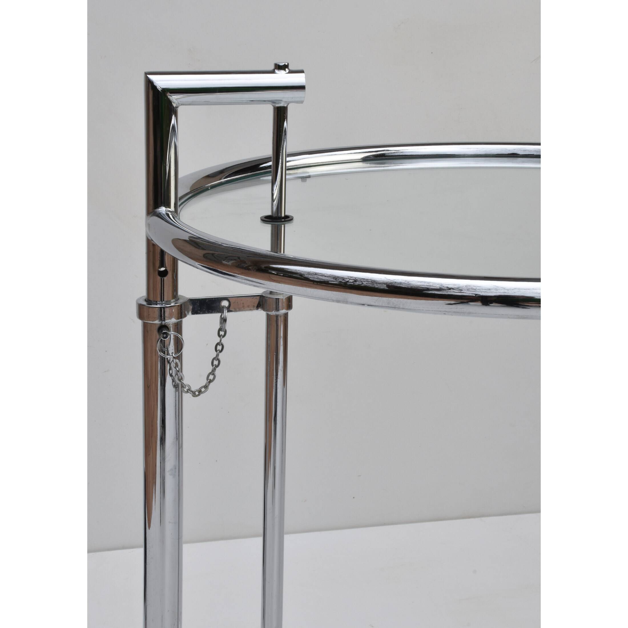 Adjustable height side table in the style of Eileen Gray.