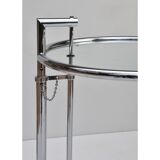 Adjustable height side table in the style of Eileen Gray.