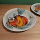 2 vintage ceramic plates with fish decoration