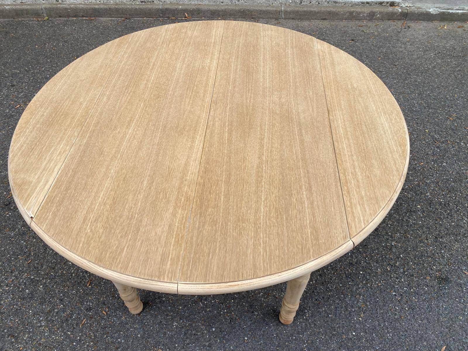 Round dining table with extendable leaves, Louis Philippe style, stripped in raw oak.