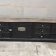 Low TV cabinet with black patina, twelve drawers and one door