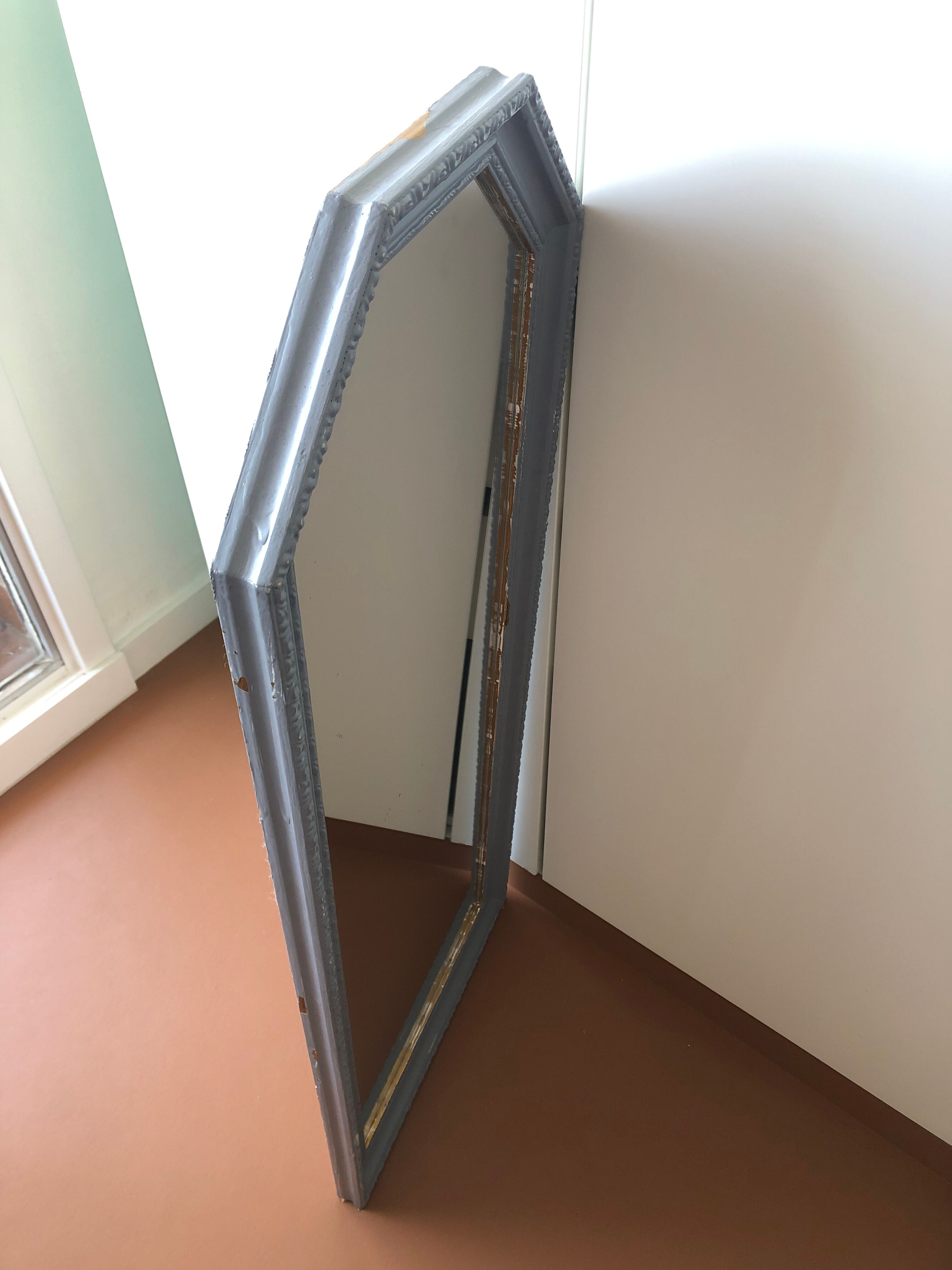 Old patinated mirror golden gray