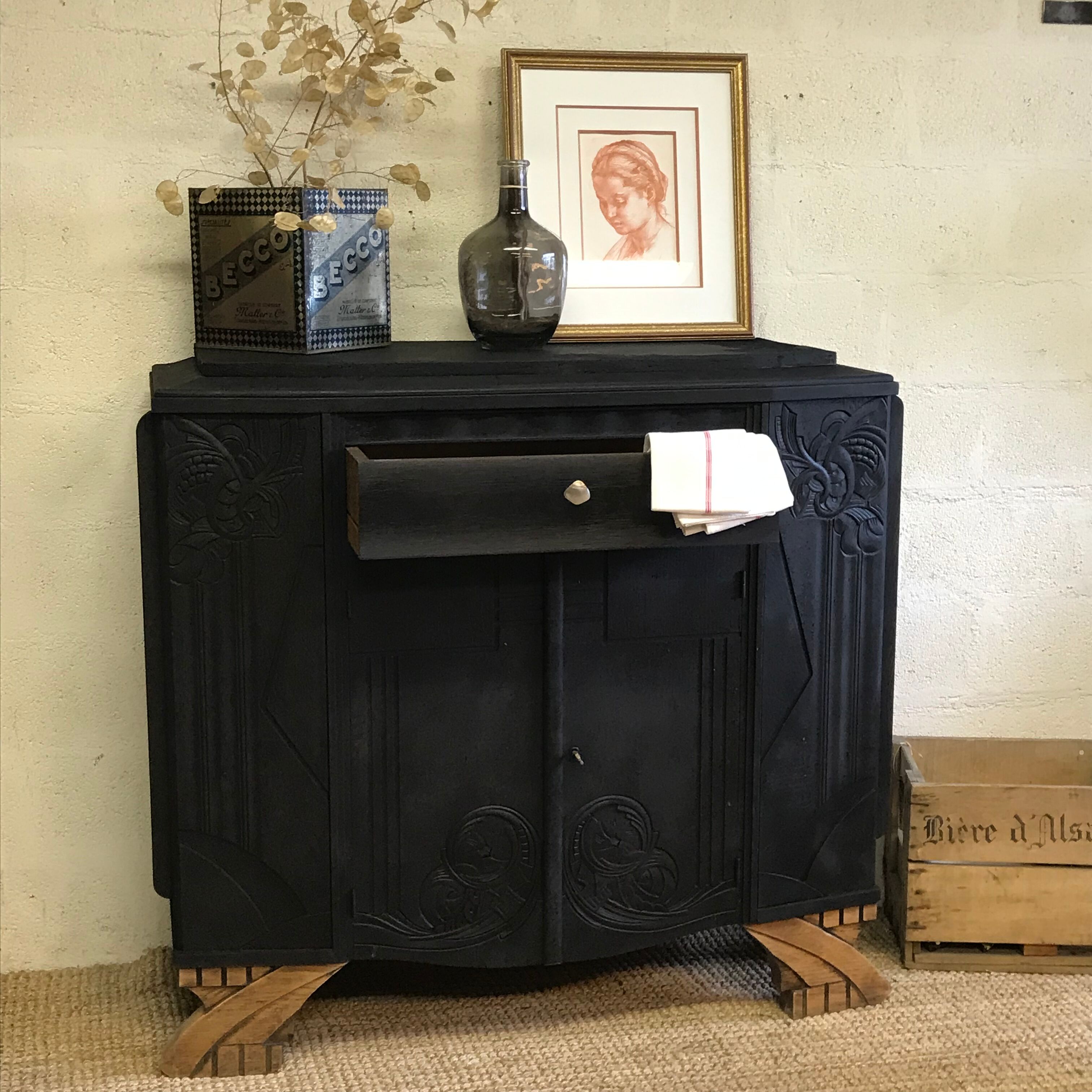 Matte black buffet and raw wood feet