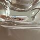 Individual ashtray in colorless crystal signed daum france followed by a cross of lorraine