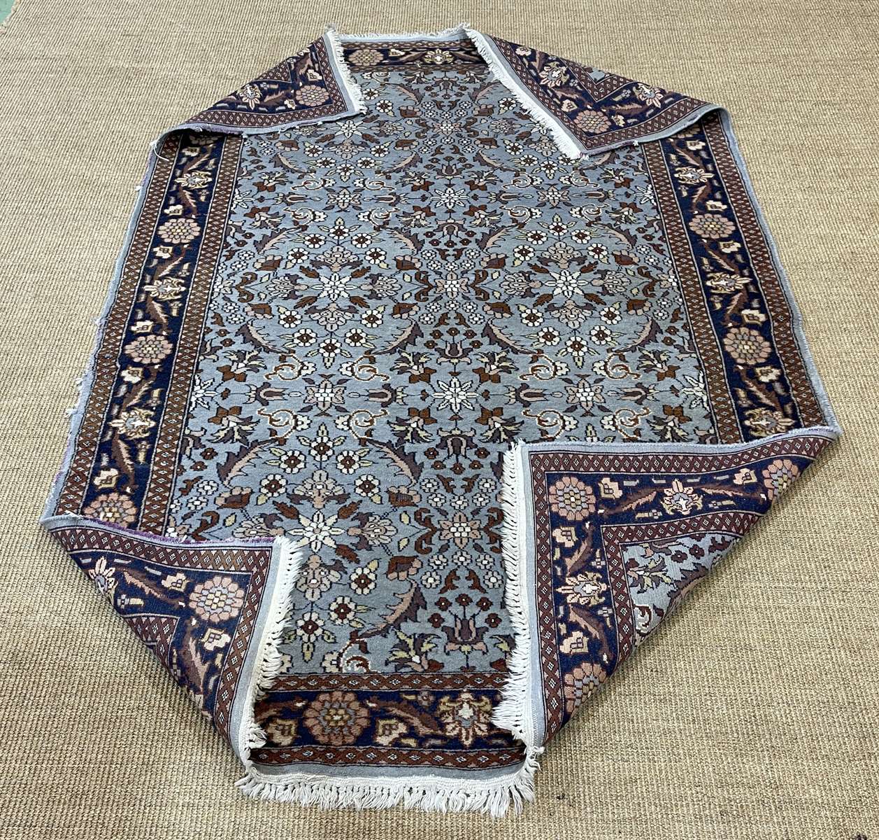 Handmade wool oriental carpet (wear defects)