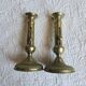 Pair of antique brass candlesticks with adjustable push mechanism from the 19th century.
