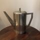 Stainless steel teapot in Art Deco style