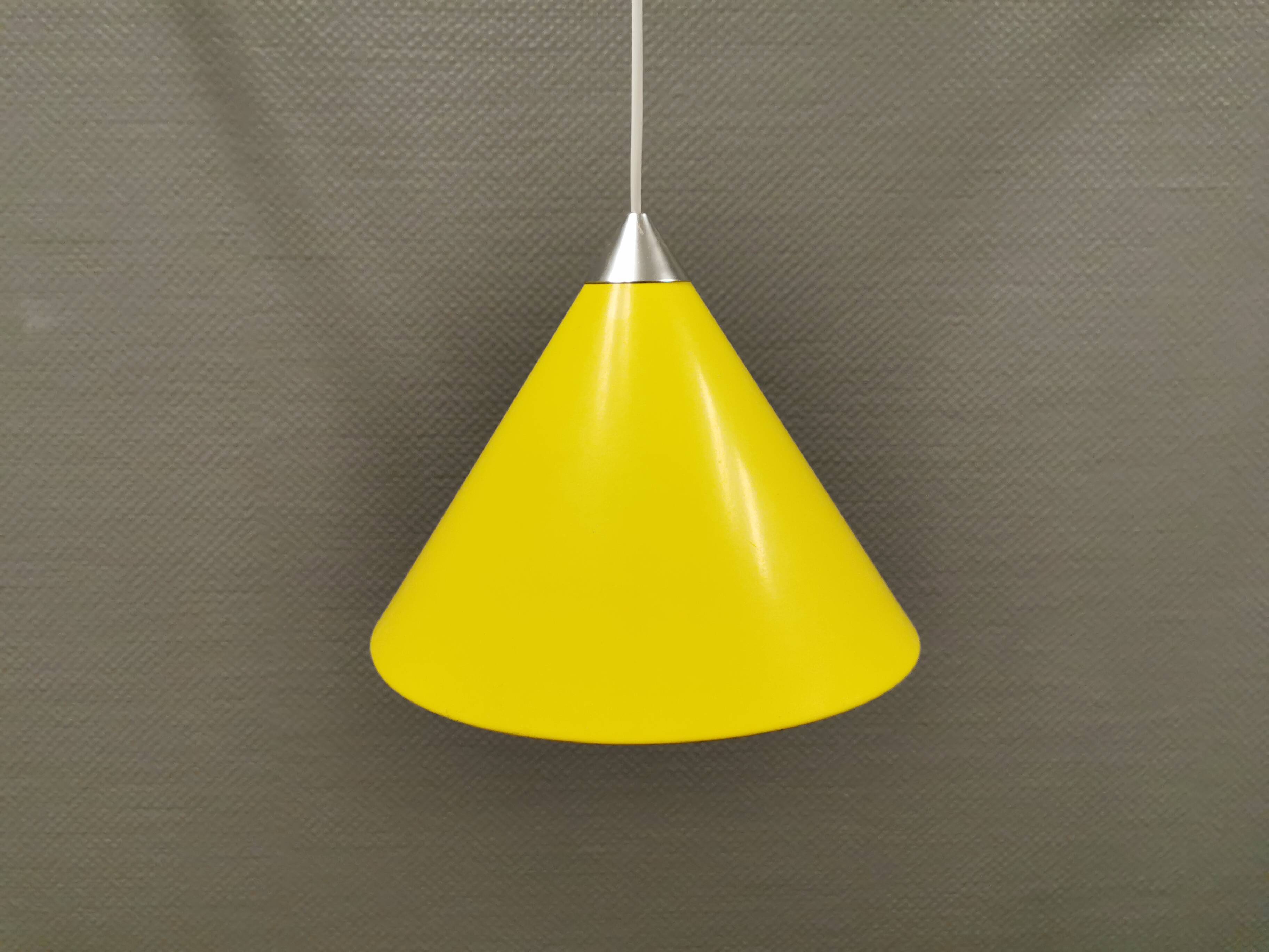 Small cone-shaped lamp in beautiful yellow lacquer finish.
