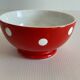 Red bowl with white polka dots signed Longchamp Porcelaine France