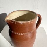 Pitcher in dark brown sandstone glazed with dotted frieze patterns
