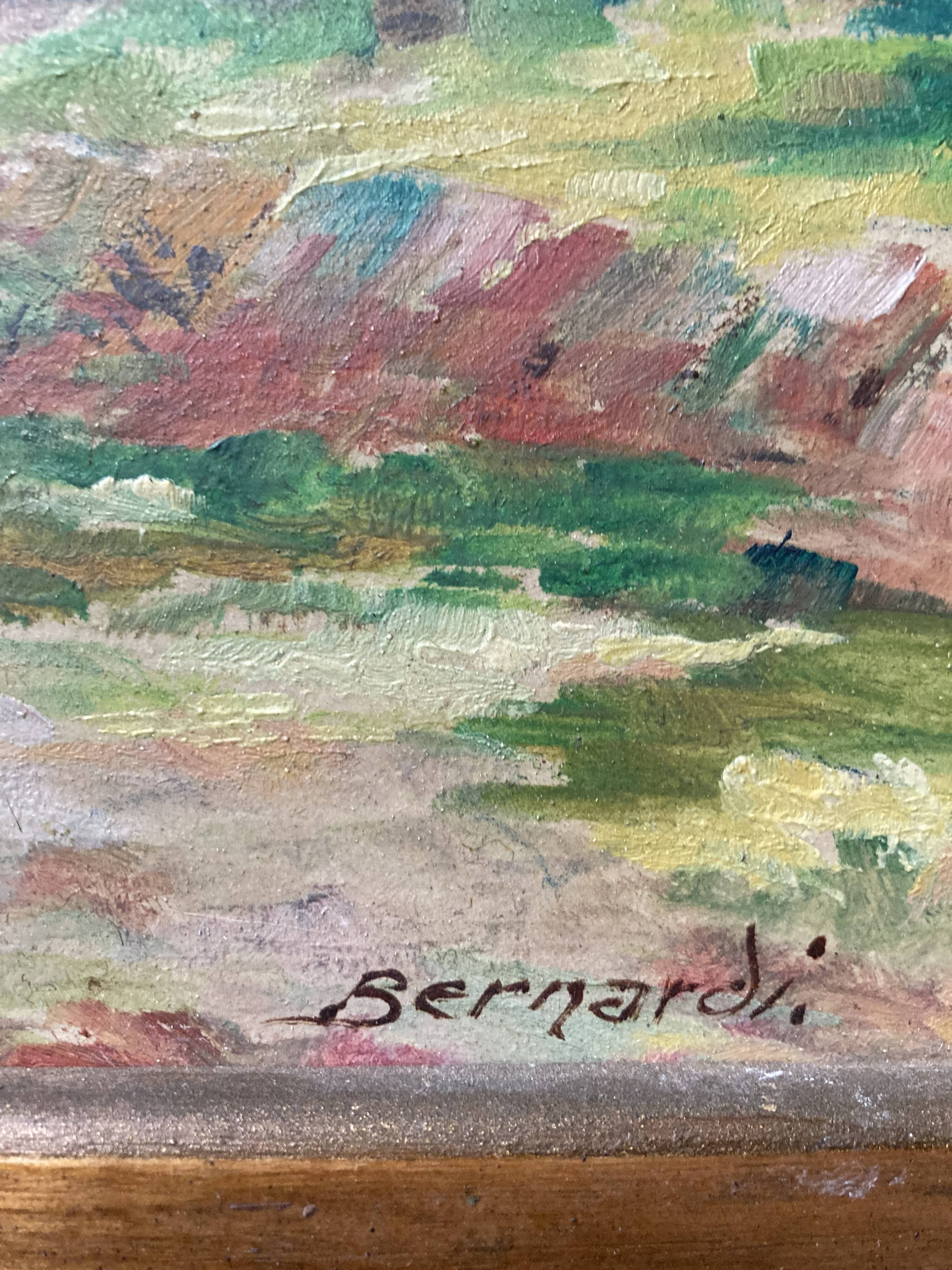 Pair of Art Deco wood and embossed metal landscape frames