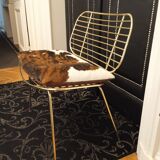 Designer gold thread armchair with cowhide cushion