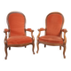 Deux fauteuils type Voltaire, en velours orange