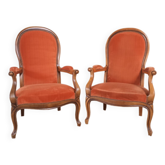 Deux fauteuils type Voltaire, en velours orange