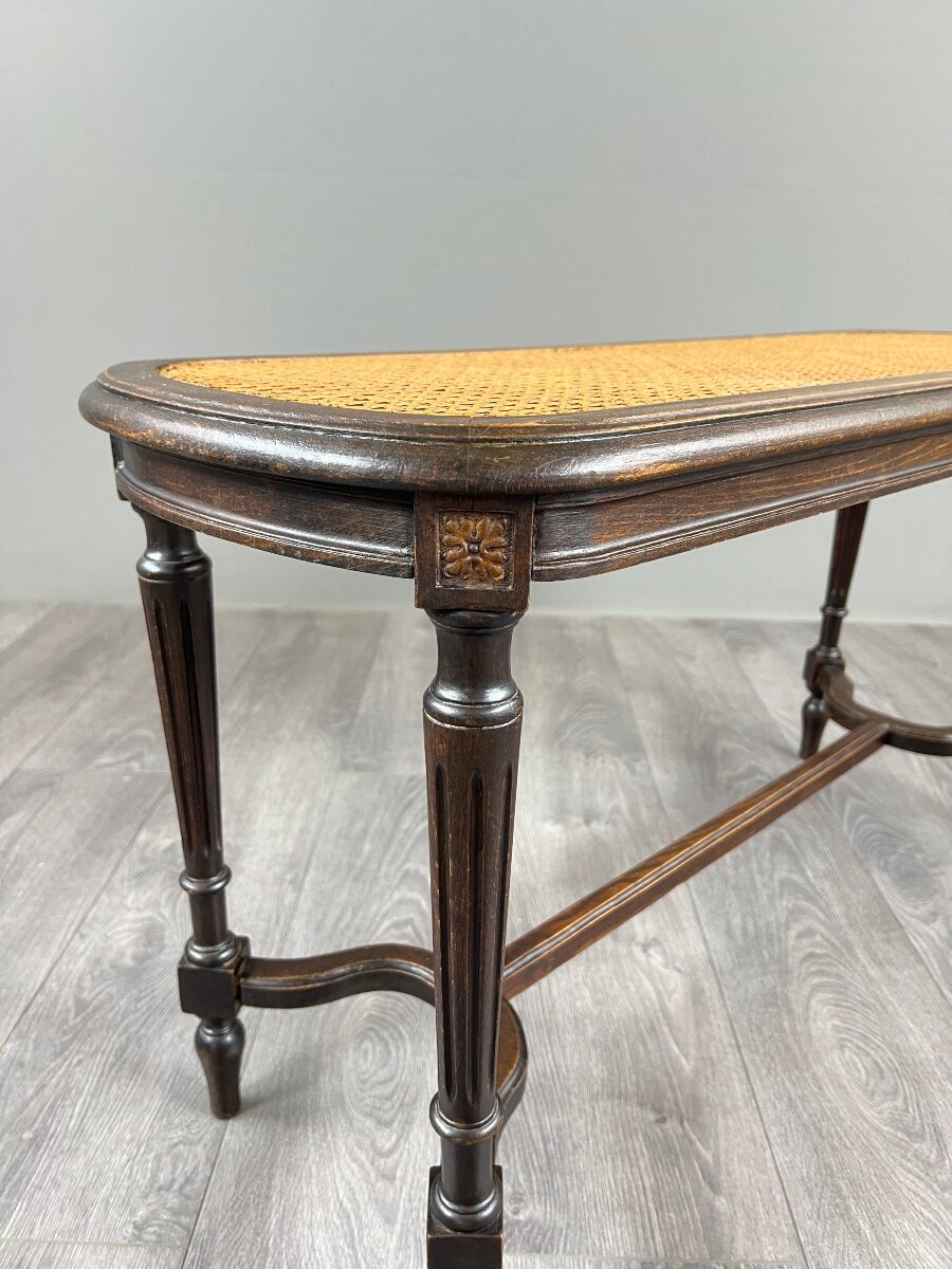 Antique wooden bench, caned seat, Louis XVI style, 20th century.