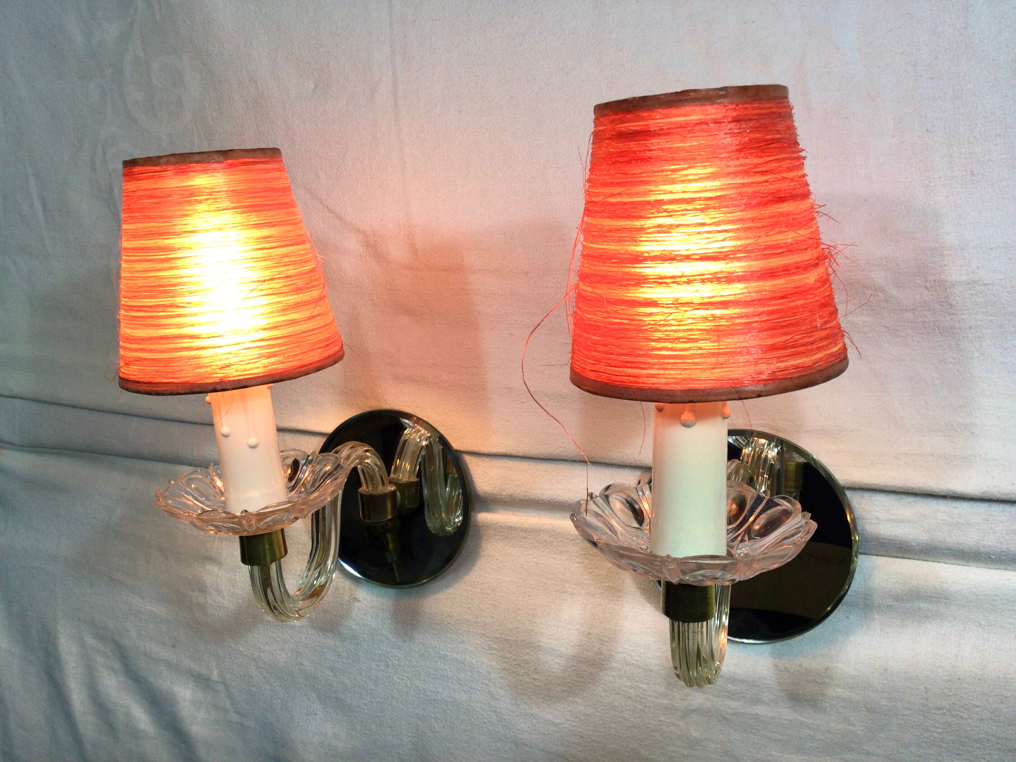 Pair of glass and mirror sconces