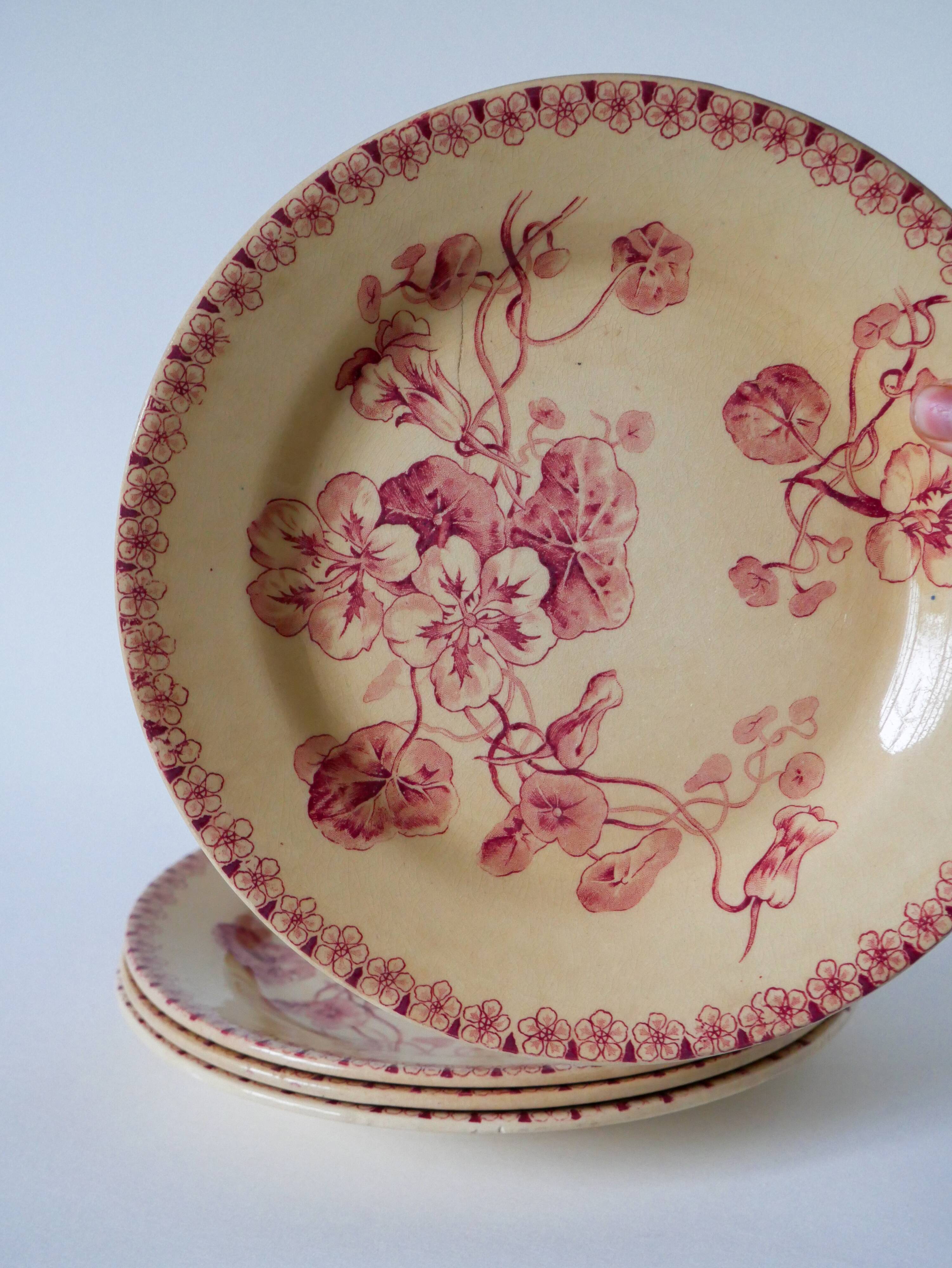 Set of 4 flat plates in Iron Earth, Gien "Capucines" model, late 19th century