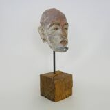 Face sculpture in polychrome earth and plaster, cabinet of curiosities. Ph Monaux. Ariège artist