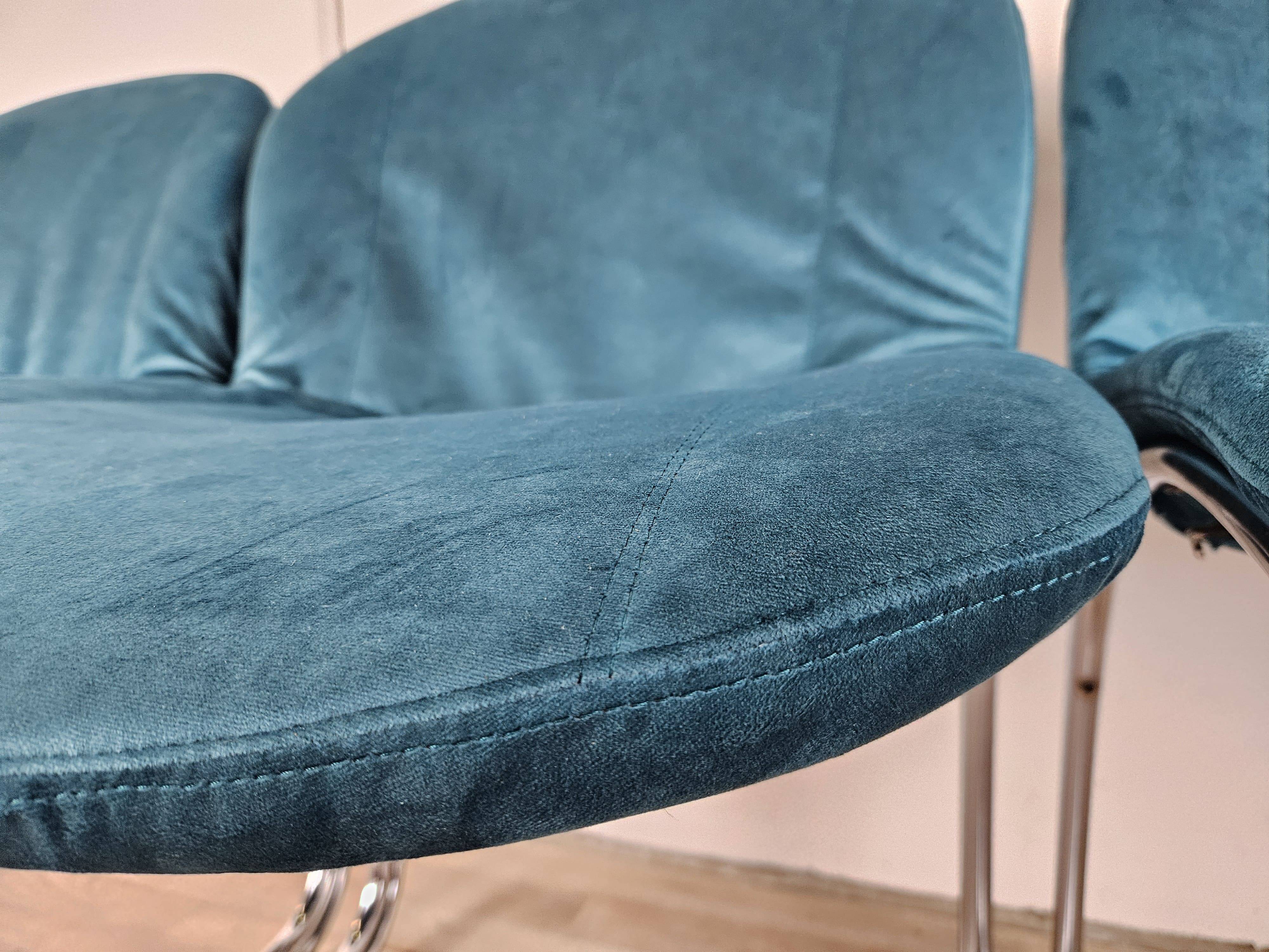 Four 1970s tubular chairs upholstered in blue velvet