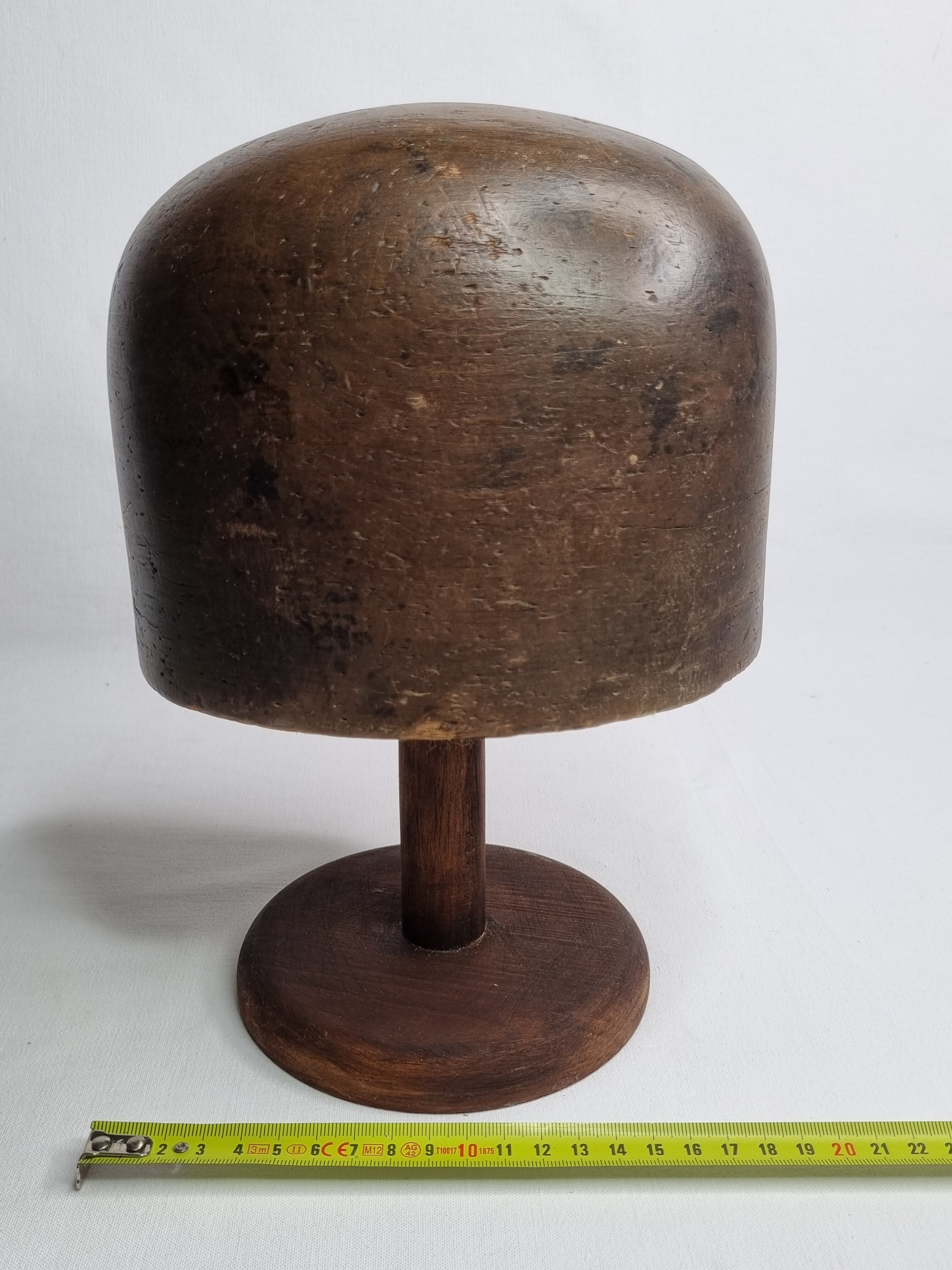 Old solid wood hat shape on foot, 1900