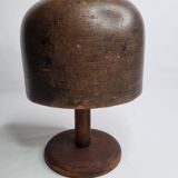 Old solid wood hat shape on foot, 1900