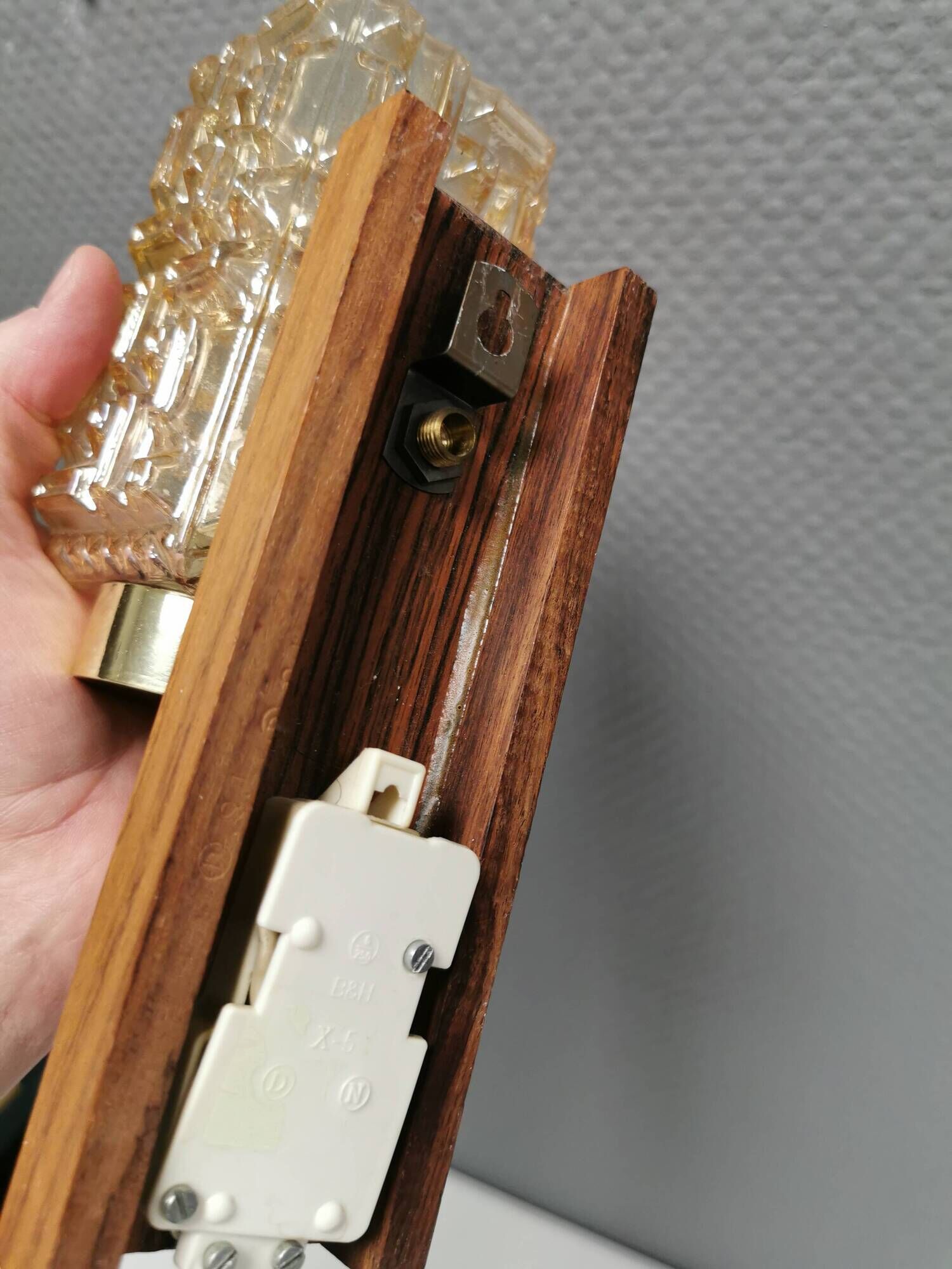 Small, stylish wall lamp with rosewood suspension and hard pressed glass