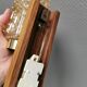 Small, stylish wall lamp with rosewood suspension and hard pressed glass
