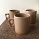 Lot of three cups or mugs stoneware of great fire of Brenne, France
