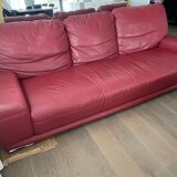 Red leather sofa with ottoman