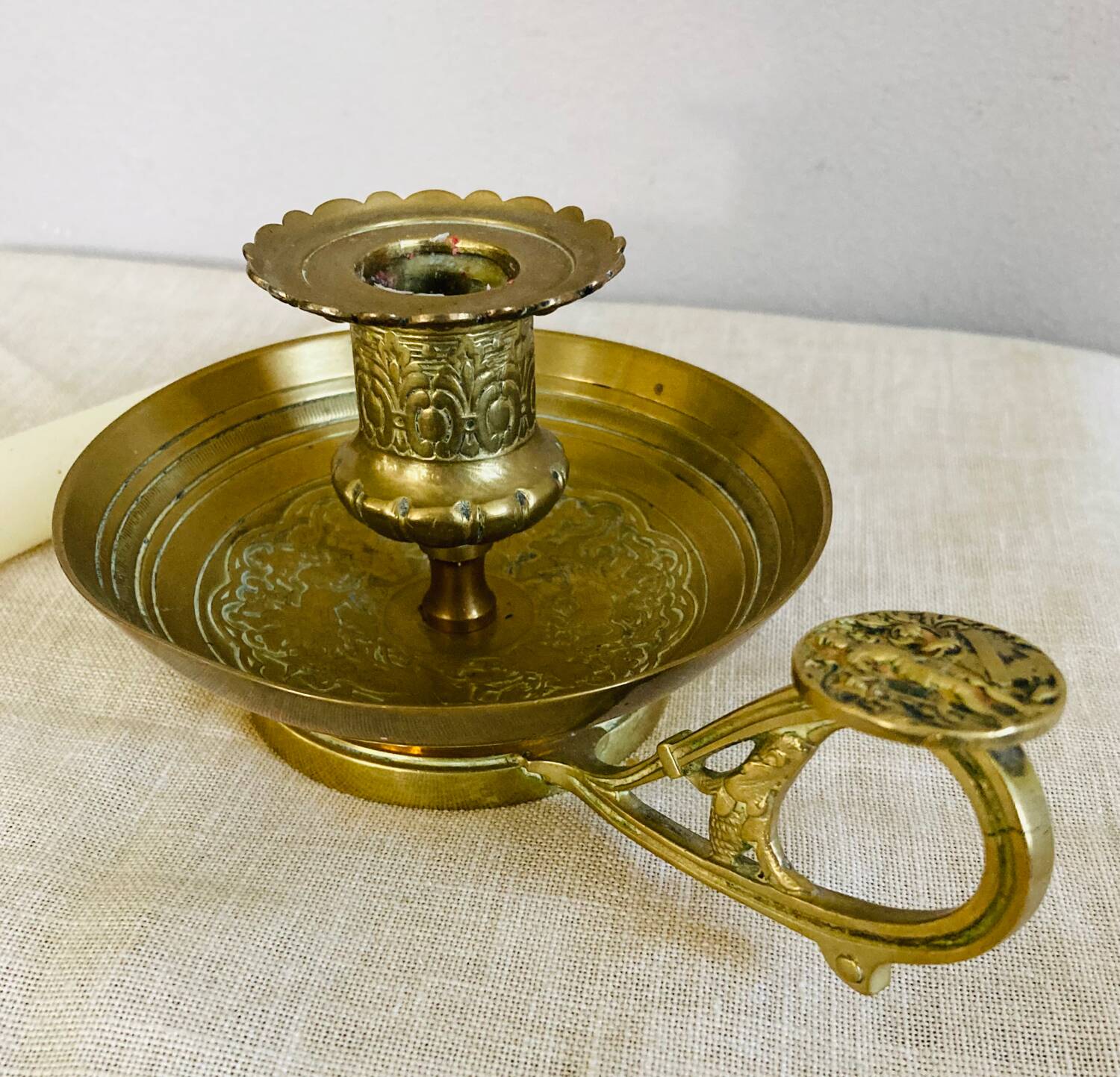 20th century chiseled brass socket candle holder representing Horsemen in armor