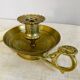 20th century chiseled brass socket candle holder representing Horsemen in armor