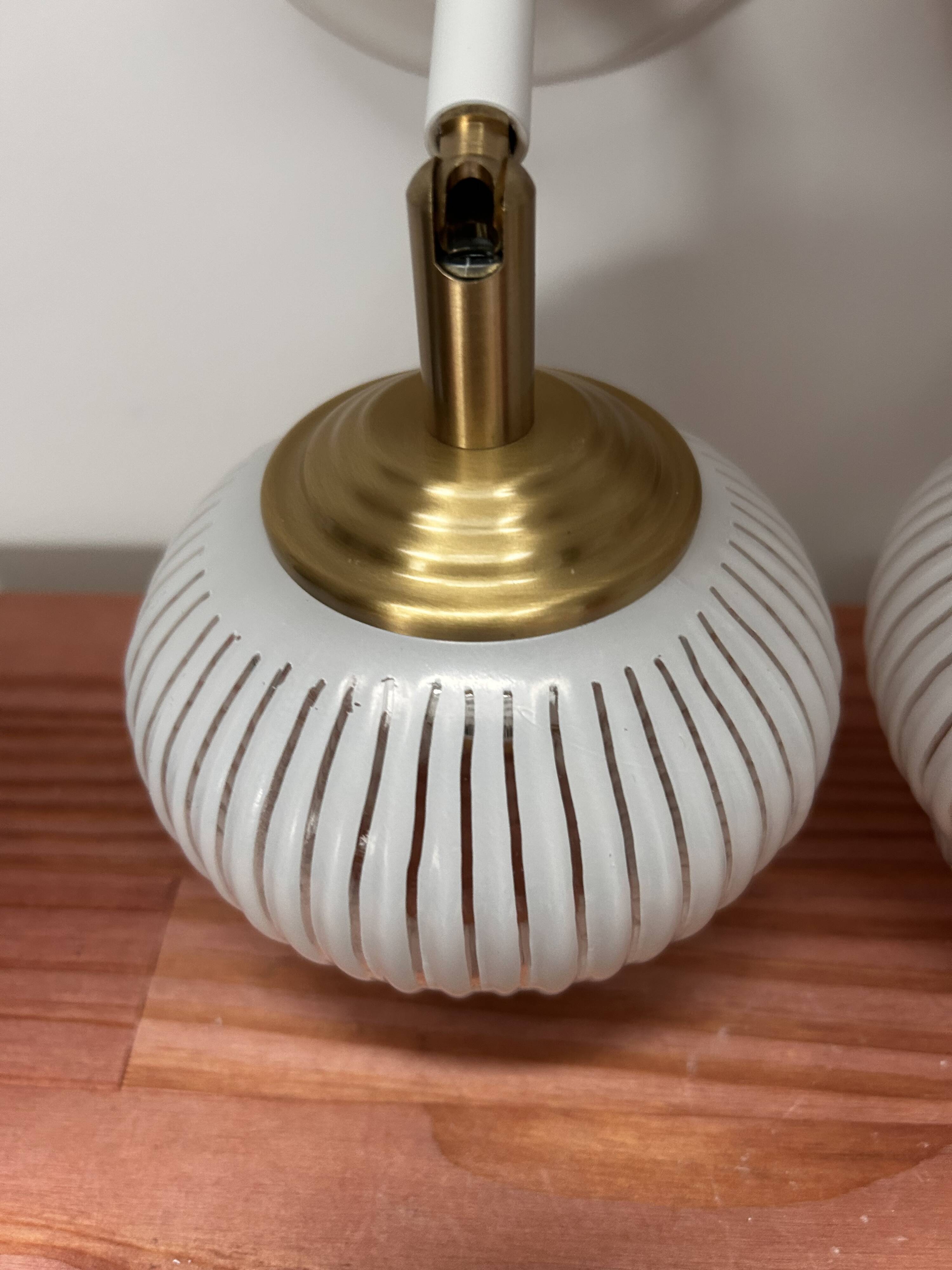 Pair of vintage white globe tilting wall sconces