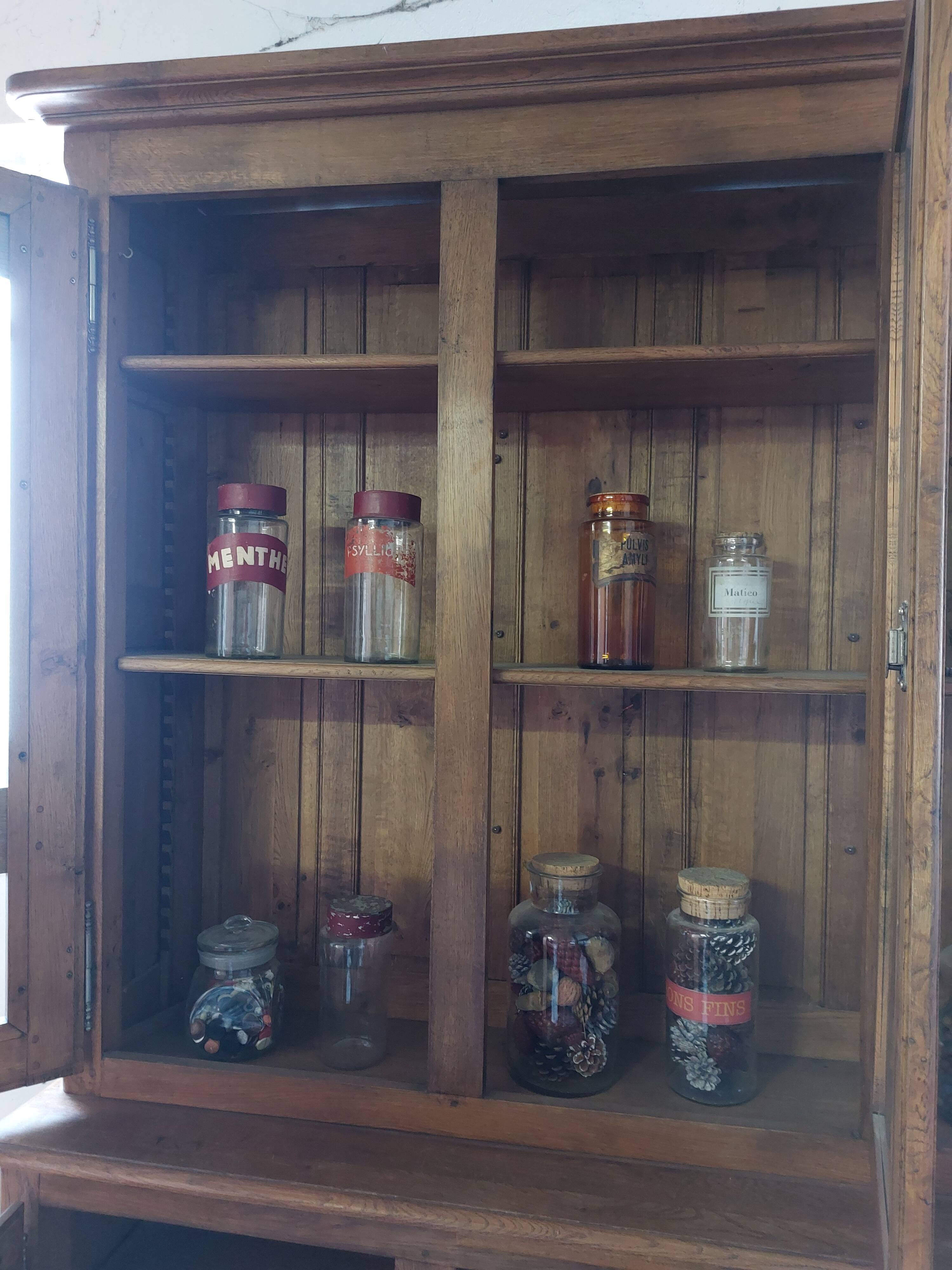 Showcase library with two sections in solid oak.
