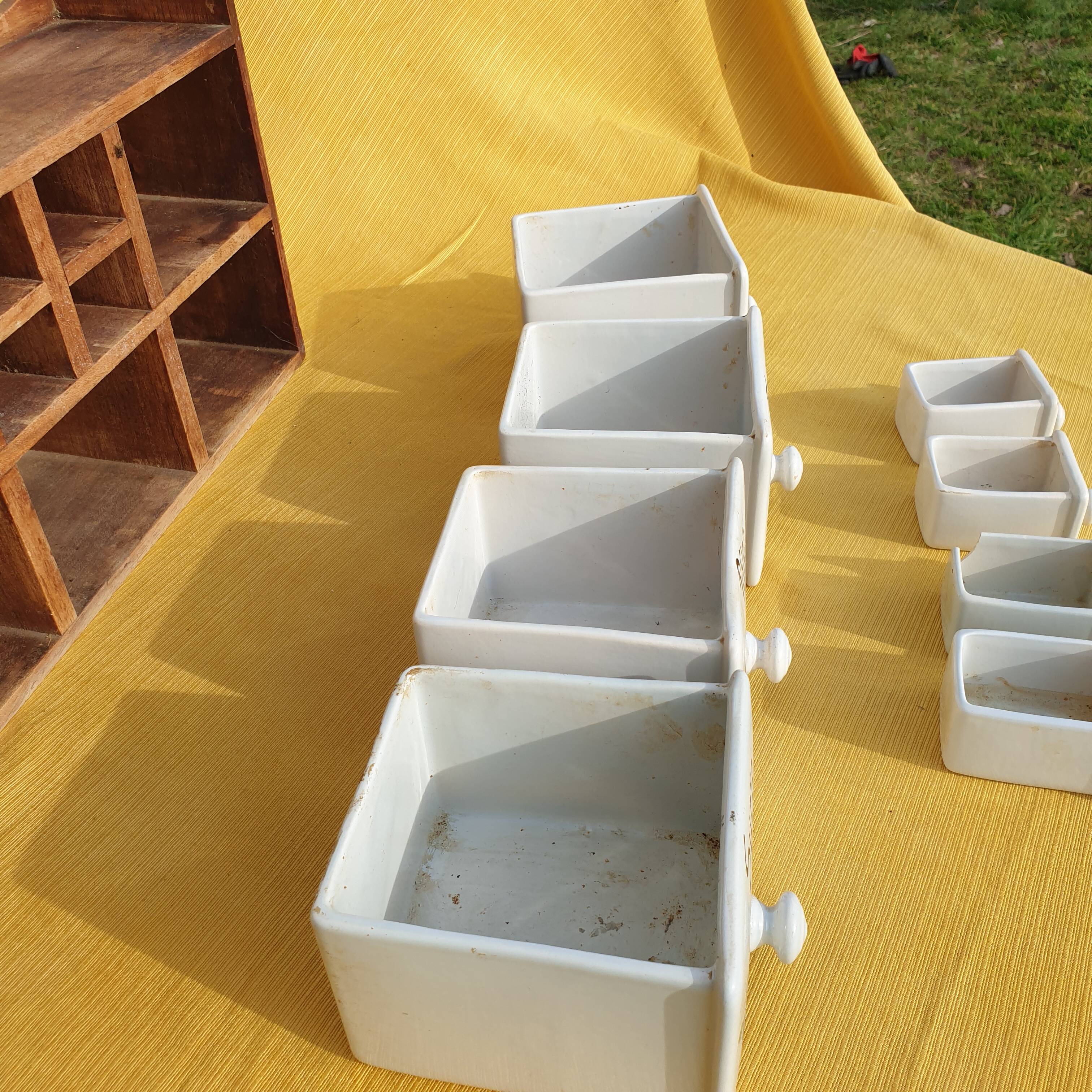 Vintage wooden spice rack with ceramic drawers