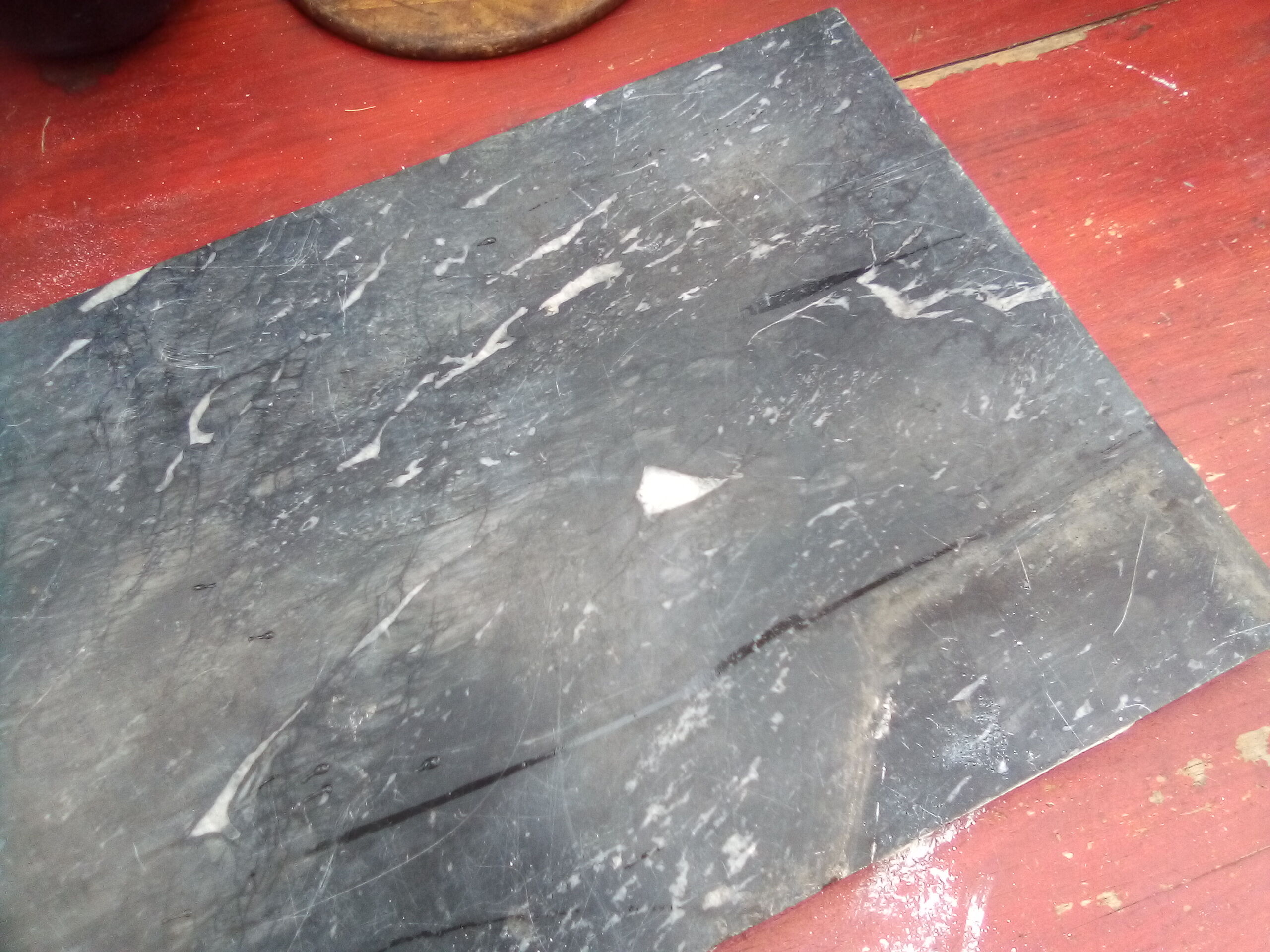 White veined black marble fireplace