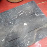 White veined black marble fireplace