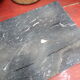 White veined black marble fireplace