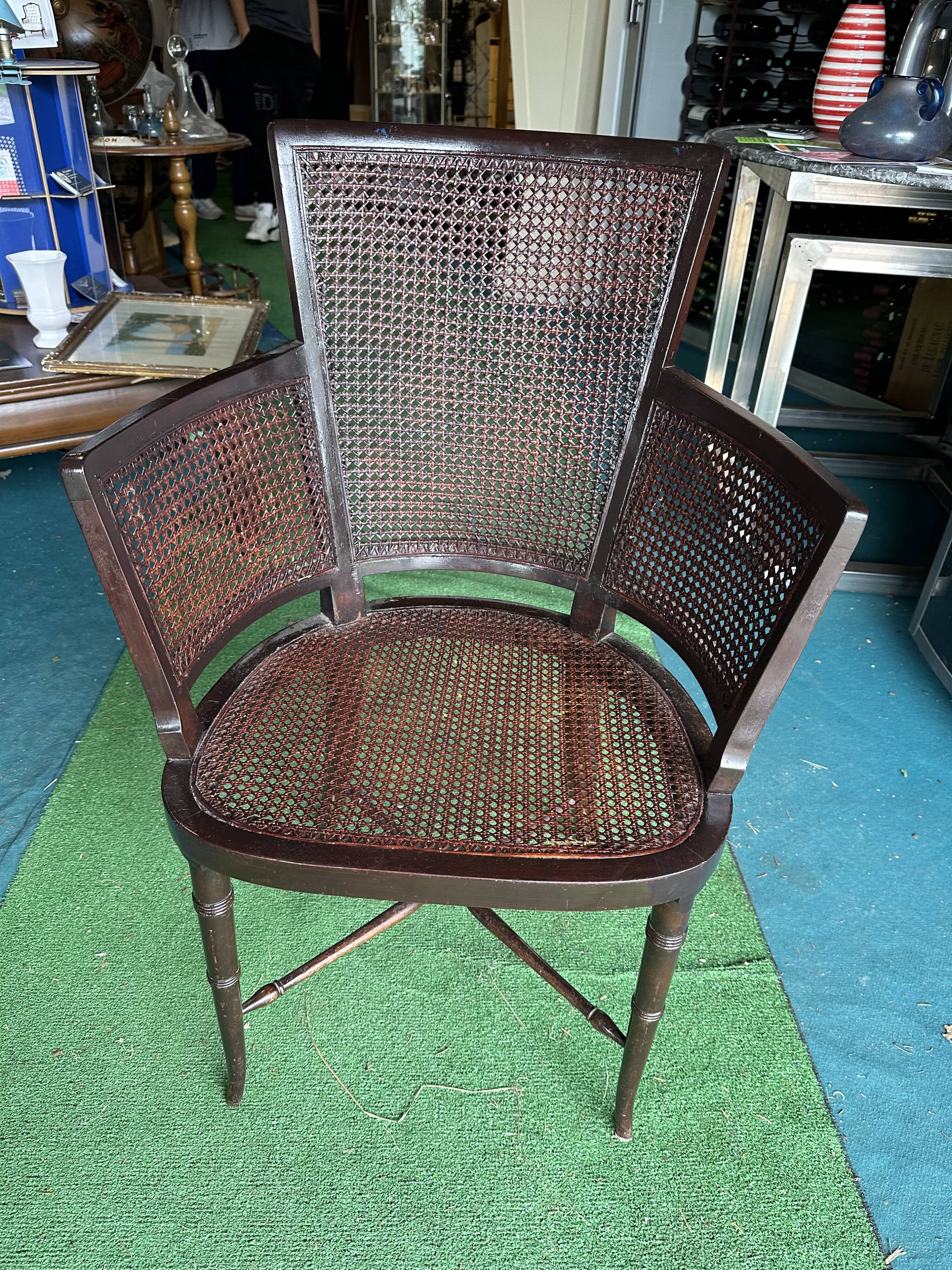 Cane armchair