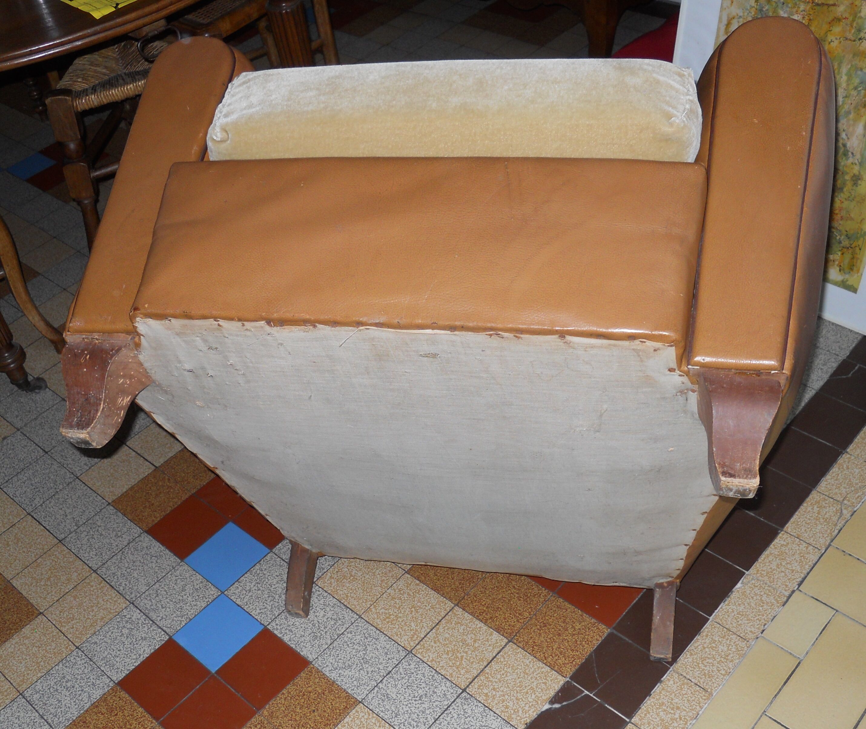 Brown leather club armchair