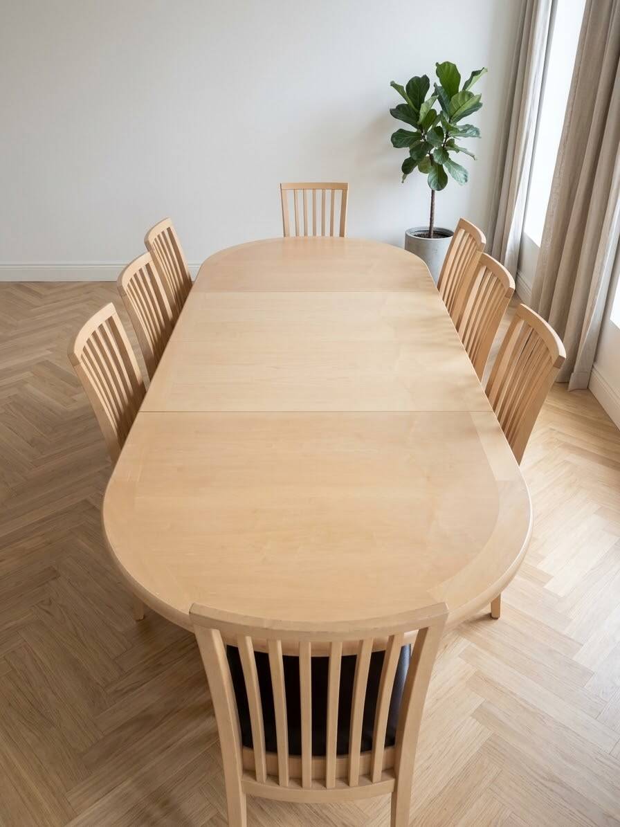Skovby dining table and 8 vintage Scandinavian style wooden chairs.