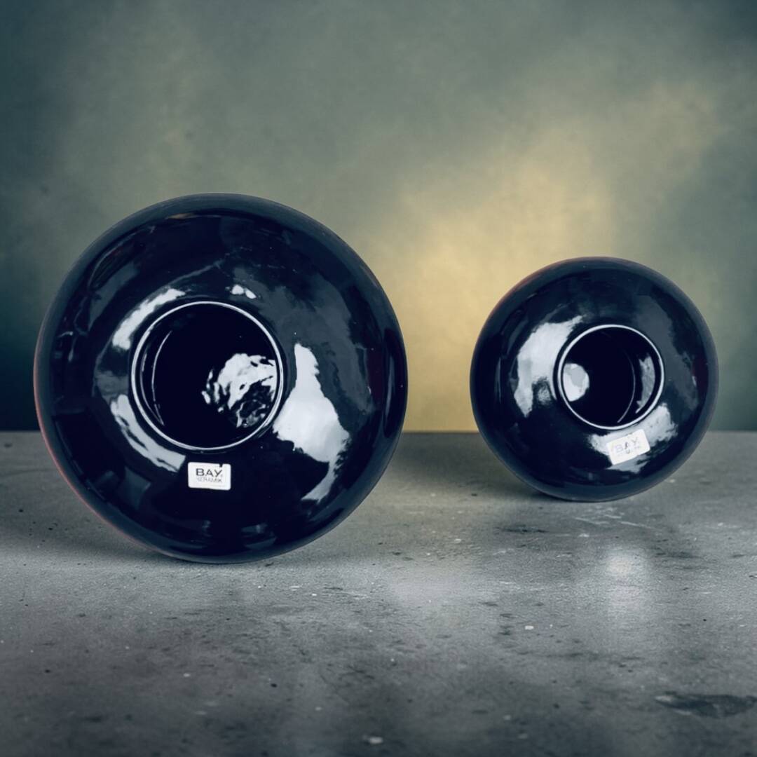 A pair of black and red spherical vases by Bay Keramik, West Germany, from the 1960s.