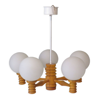 Space age chandelier in 5-arm wood with white frosted opaline glass spheres.