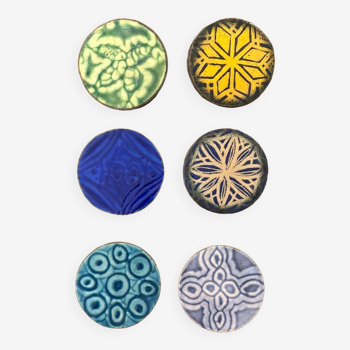 Six old enameled glass coasters. Psychedelic forms
