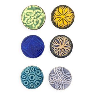 Six old enameled glass coasters. Psychedelic forms