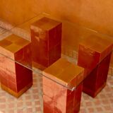 Modern coffee table in burgundy zellige with a tempered glass top.