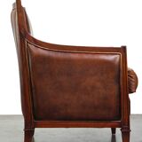 Comfortable Art Deco design armchair in cognac-colored sheepskin combined with wood