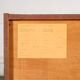 Old TV cabinet with brass handles.